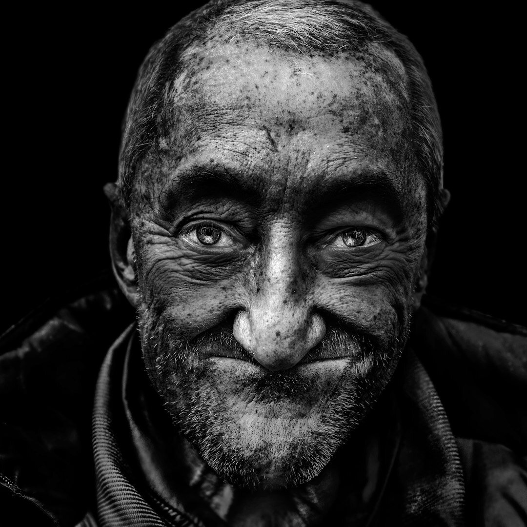 Elderly Croatian fisherman portrait on a wooden dock